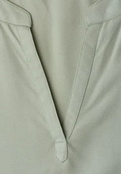 Blouse à épaules tombantes avec col fendu