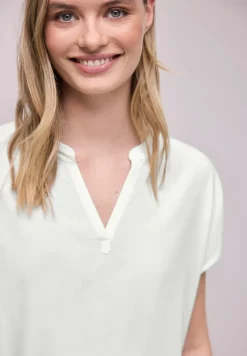 Blouse à épaules tombantes avec col fendu