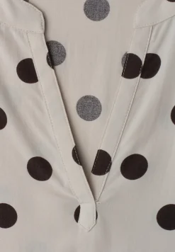 Blouse à épaules tombantes avec col fendu