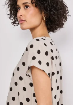 Blouse à épaules tombantes avec col fendu
