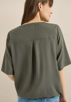 Blouse avec col fendu et ourlet élastique