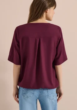 Blouse avec col fendu et ourlet élastique