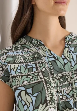 Blouse avec col fendu et mélange de structures