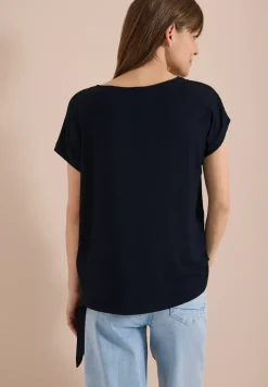 Blouse avec col rond et détail de nœuds