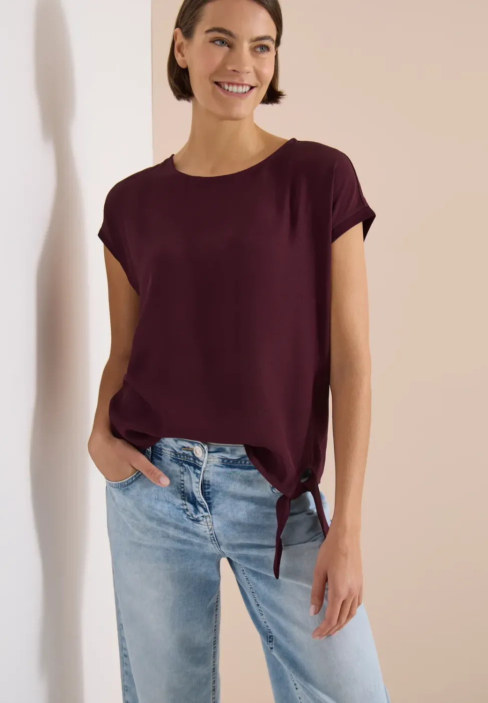 Blouse avec col rond et détail de nœuds