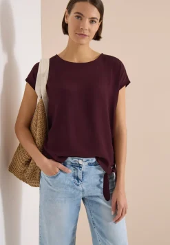 Blouse avec col rond et détail de nœuds