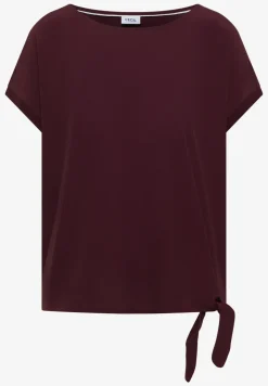 Blouse avec col rond et détail de nœuds