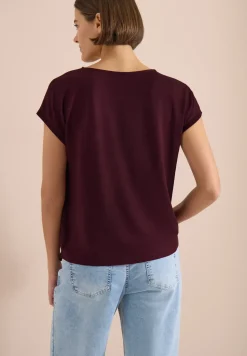 Blouse avec col rond et détail de nœuds