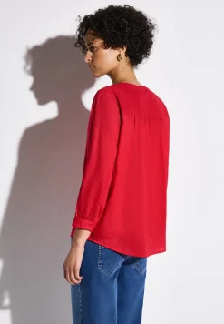 Blouse avec détails en tape