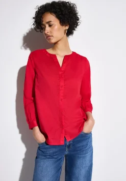 Blouse avec détails en tape