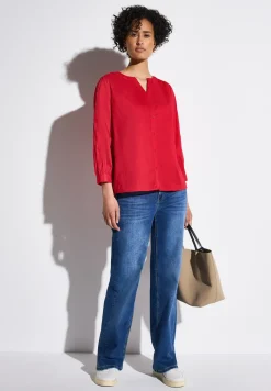 Blouse avec détails en tape