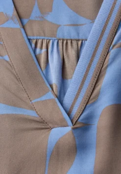 Blouse avec détails en tape