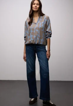 Blouse avec détails en tape