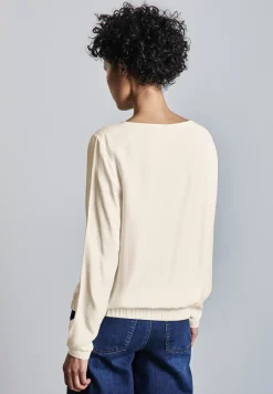 Blouse avec ourlet froncé