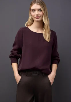 Blouse avec poignets smockés