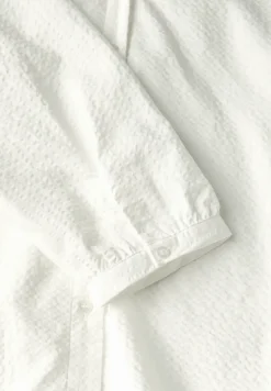Blouse en seersucker à col fendu