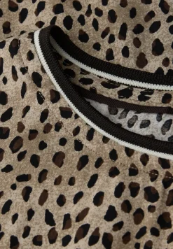 Blouse léopard avec détails en bande