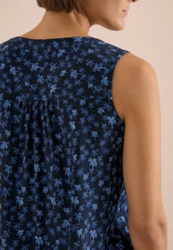 Blouse sans manches à col fendu et imprimé palmiers