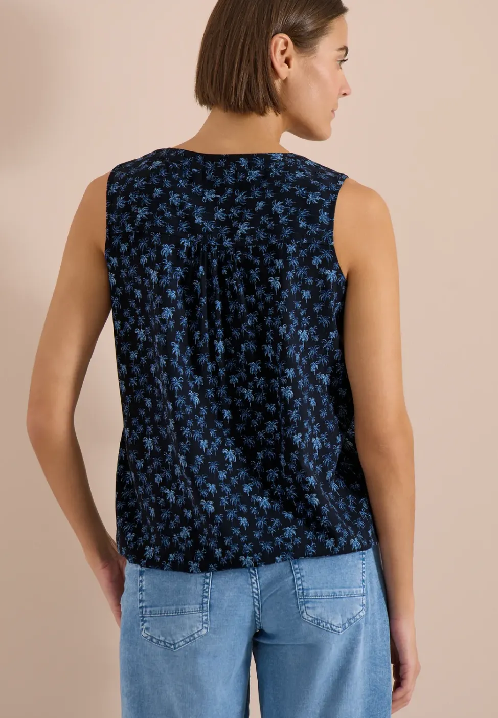 Blouse sans manches à col fendu et imprimé palmiers