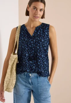 Blouse sans manches à col fendu et imprimé palmiers