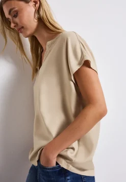 Blouse split neck en couleur unie