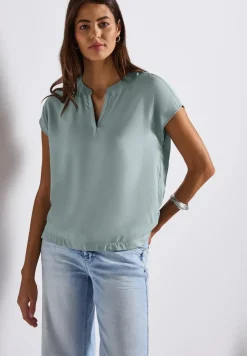 Blouse split neck en couleur unie