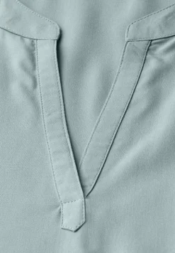Blouse split neck en couleur unie