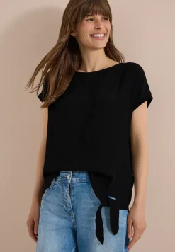 Blouse avec col rond et détail de nœuds