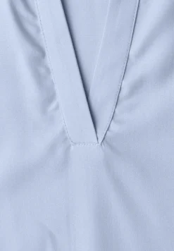 Blouse à col chemise et ourlet élastiqué