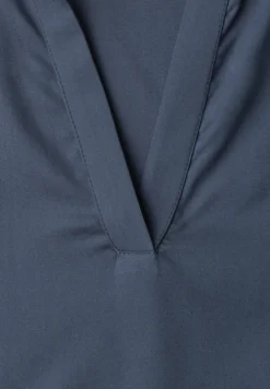 Blouse à col chemise et ourlet élastiqué