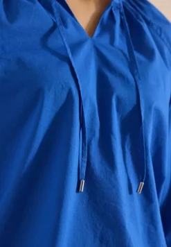 Blouse à manches 3/4 avec col fendu en couleur unie