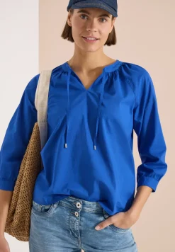 Blouse à manches 3/4 avec col fendu en couleur unie