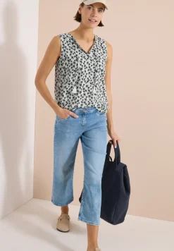 Blouse sans manches à col fendu et imprimé palmiers