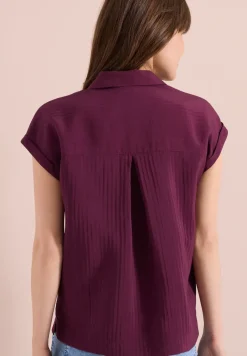 Blouse structurée à épaules tombantes