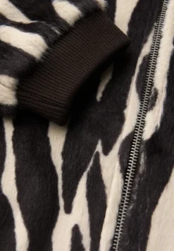 Blouson en fausse fourrure zébrée