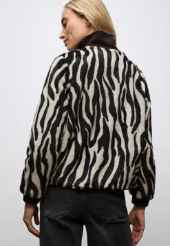 Blouson en fausse fourrure zébrée