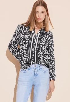 Chemisier avec mélange de motifs