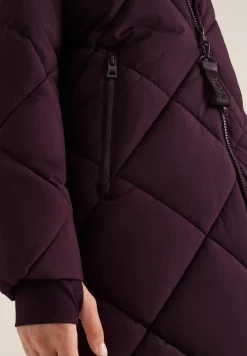 Manteau avec sac à dos Strings