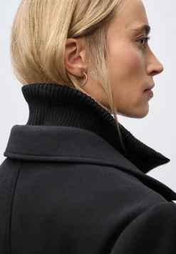 Manteau à revers avec incrustation