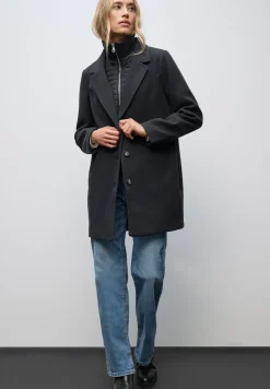Manteau à revers avec incrustation