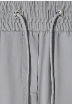 Pantalon taille mi-haute coupe slim