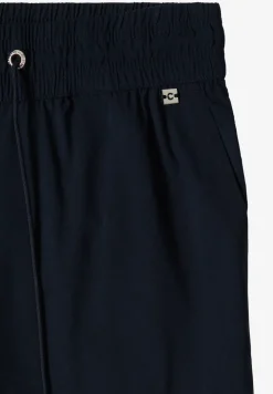 Pantalon taille mi-haute coupe slim