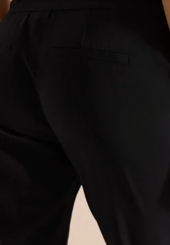 Pantalon taille mi-haute coupe slim