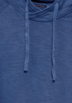 Pull à l'aspect délavé