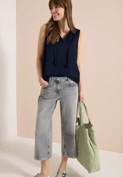 Top chemisier avec split neck et rubans