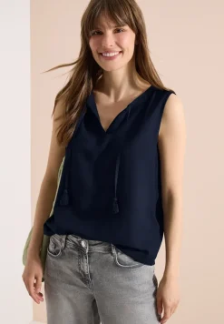Top chemisier avec split neck et rubans