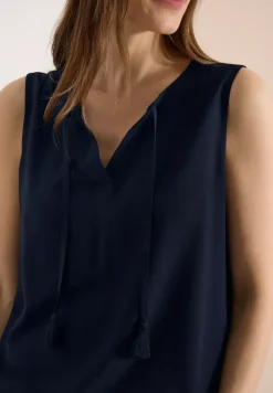 Top chemisier avec split neck et rubans