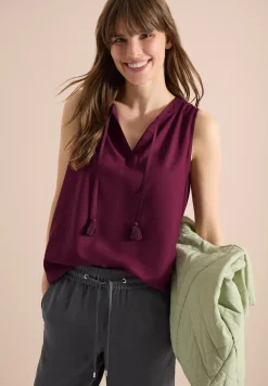 Top chemisier avec split neck et rubans