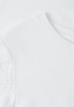 T-shirt à col rond et manches motif ajouré