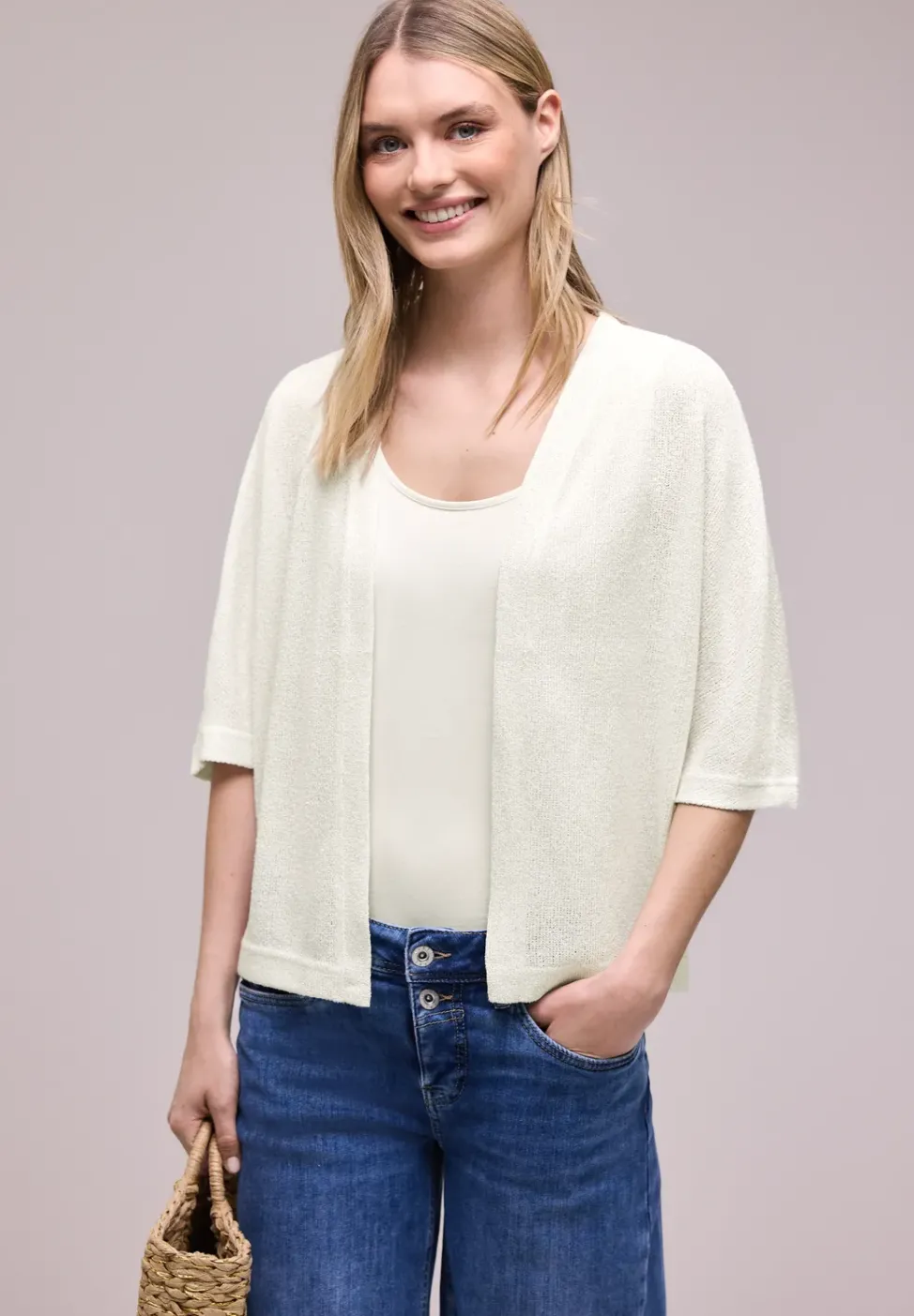 Veste en maille pailletée à manches courtes